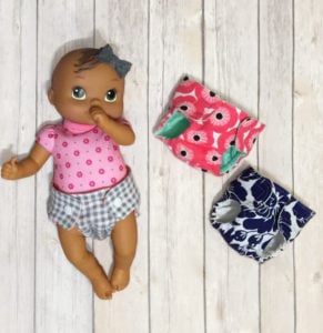 I’m sharing a how-to for cloth dolly diapers I made with this free dolls diaper pattern. Because even baby dolls can be environmentally friendly!