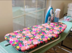 Customize your sewing room with this DIY ironing board cover tutorial! It's quick and easy to give your sewing space an bit of magic with this pattern.
