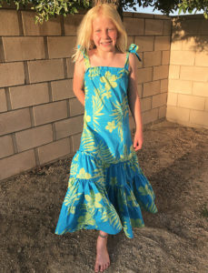 Swing into summer with a stylish silhouette! The children’s Tie Shoulder Tiered Dress is a breezy summer dress that comes in sizes12 months to 12 years.